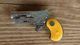 Dyna-Mite derringer cap gun yellow grips toy